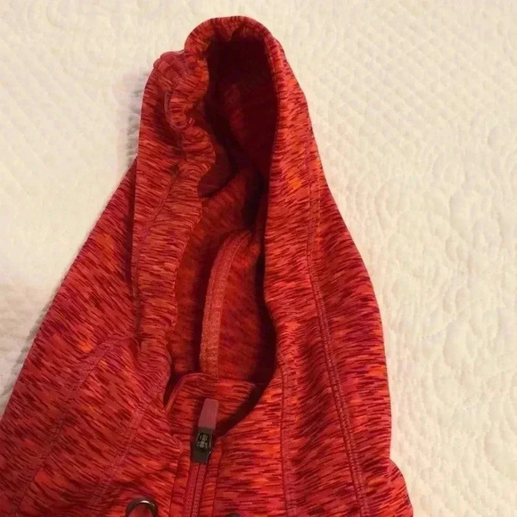 Athleta hoodie with two open pockets on front and zippered pocket on sleeve. - Picture 7 of 13